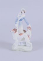 A porcelain figure of a lady with two dogs 'Daisy', Royal Doulton.
