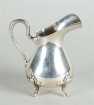Silver cream jug, marked with sword and 835. 