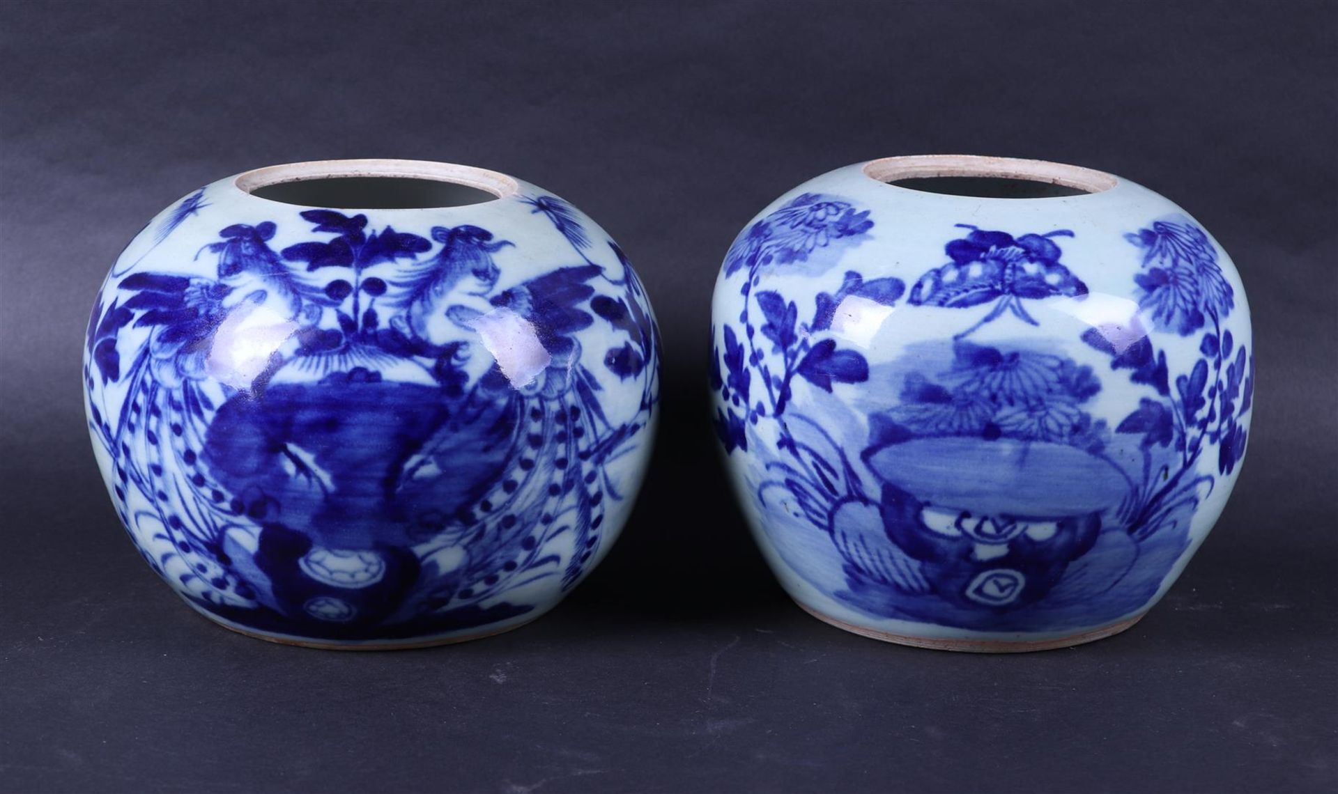 Two porcelain storage jars with floral decor. China, late 19th century
