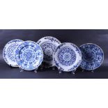 A lot of five large earthenware dishes with floral décor