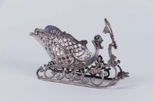 A silver scale model of a sleigh. Marked '835'.