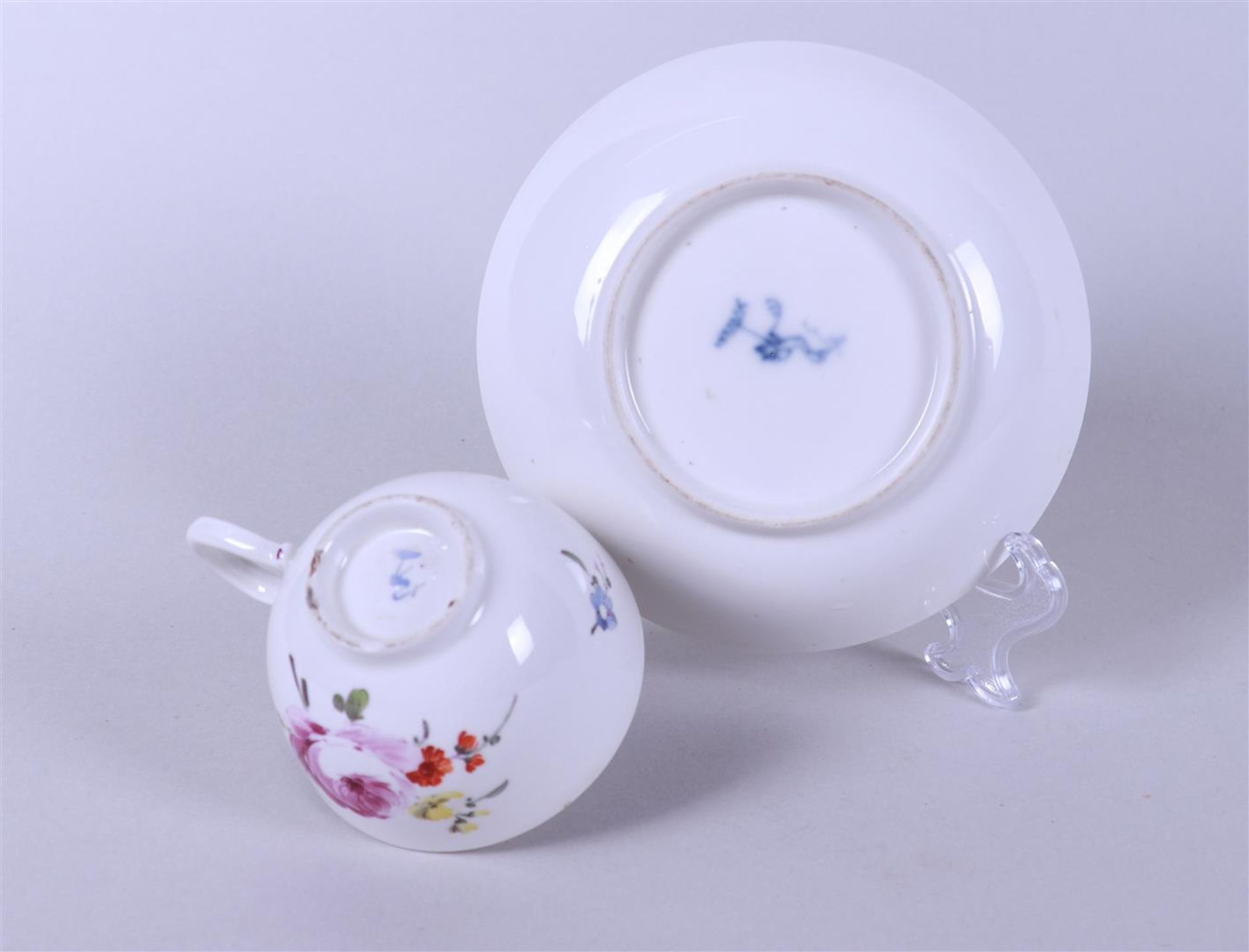 A cup and saucer with floral decor, marked on the bottom.  - Image 3 of 3