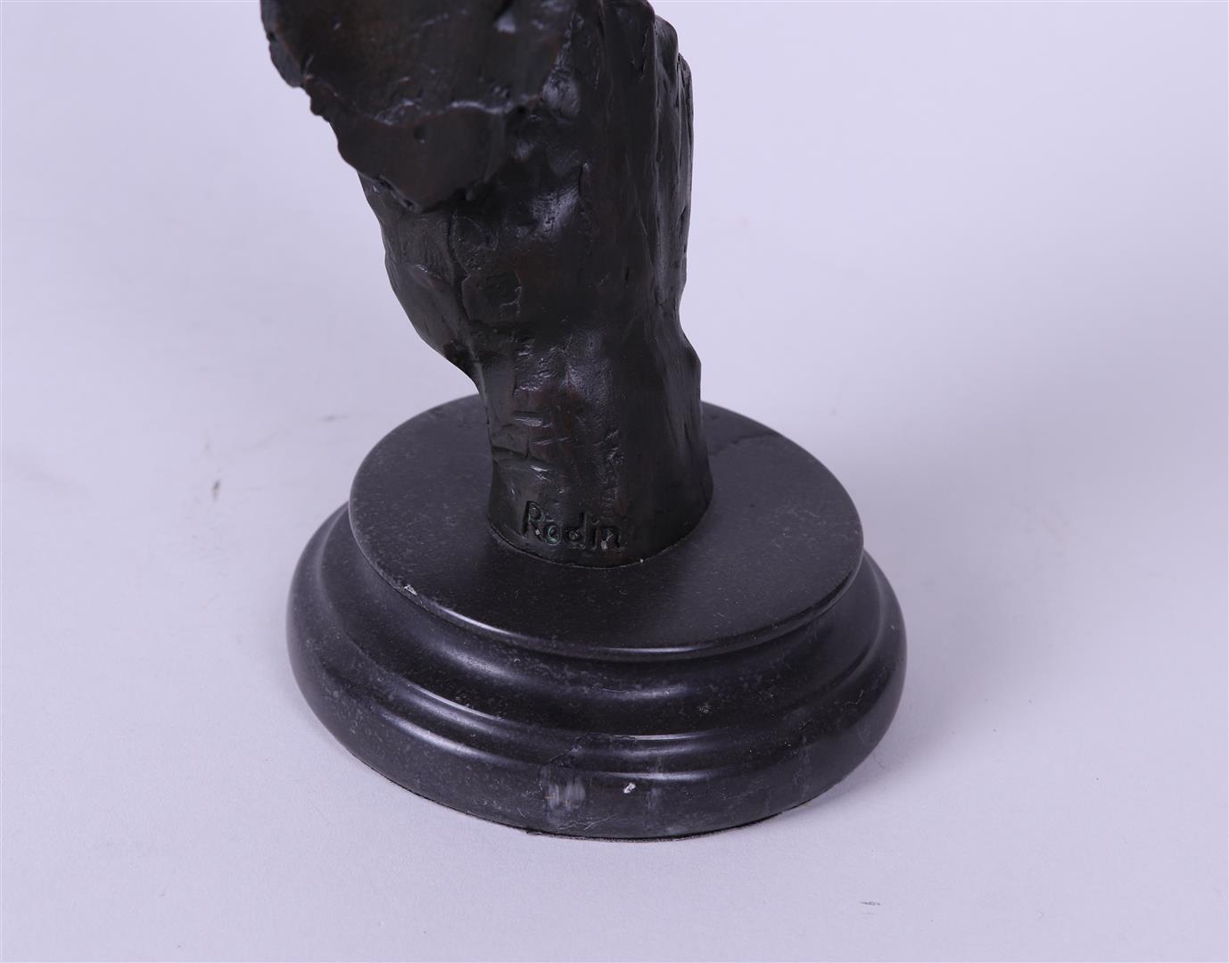 A bronze sculpture of a man calling for silence.  - Image 3 of 3