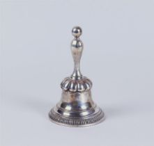 A silver table bell with a copper bell on the inside. Marked ISW (possibly Jacobus Schalkwijk 1818 -