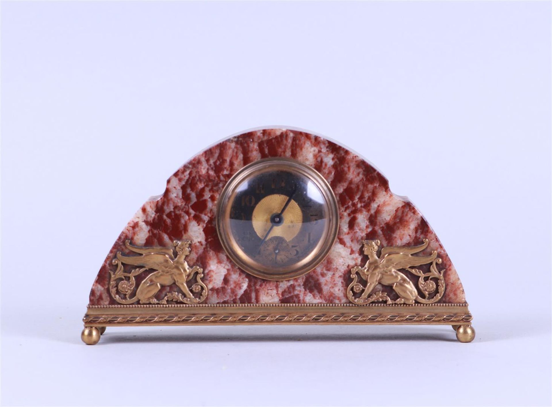 Art deco marble clock with two sphinxes.

