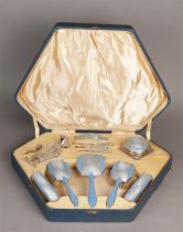 An Art Deco dressing table set in silver and enamel