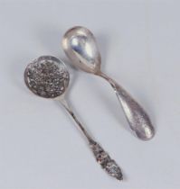 A silver wet fruit scoop 20th century and a compote spoon engraved