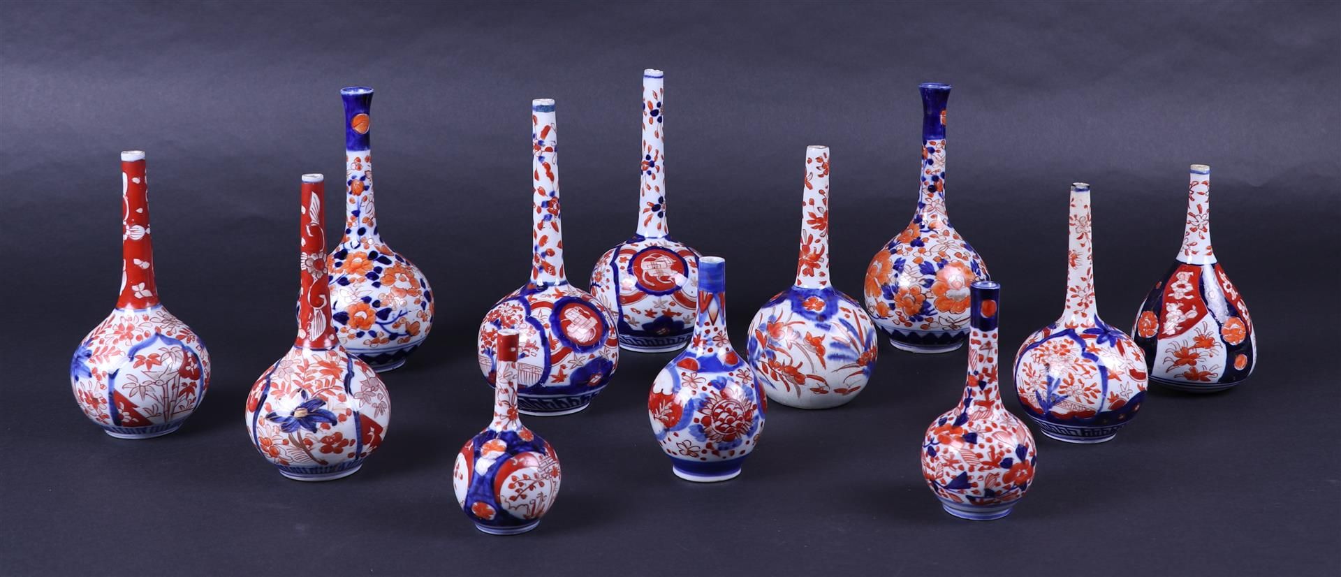 A lot of twelve Imari pipe vases. Japan, 19th century.
