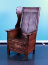 An elm wood baking chair, France, first quarter of the 18th century.