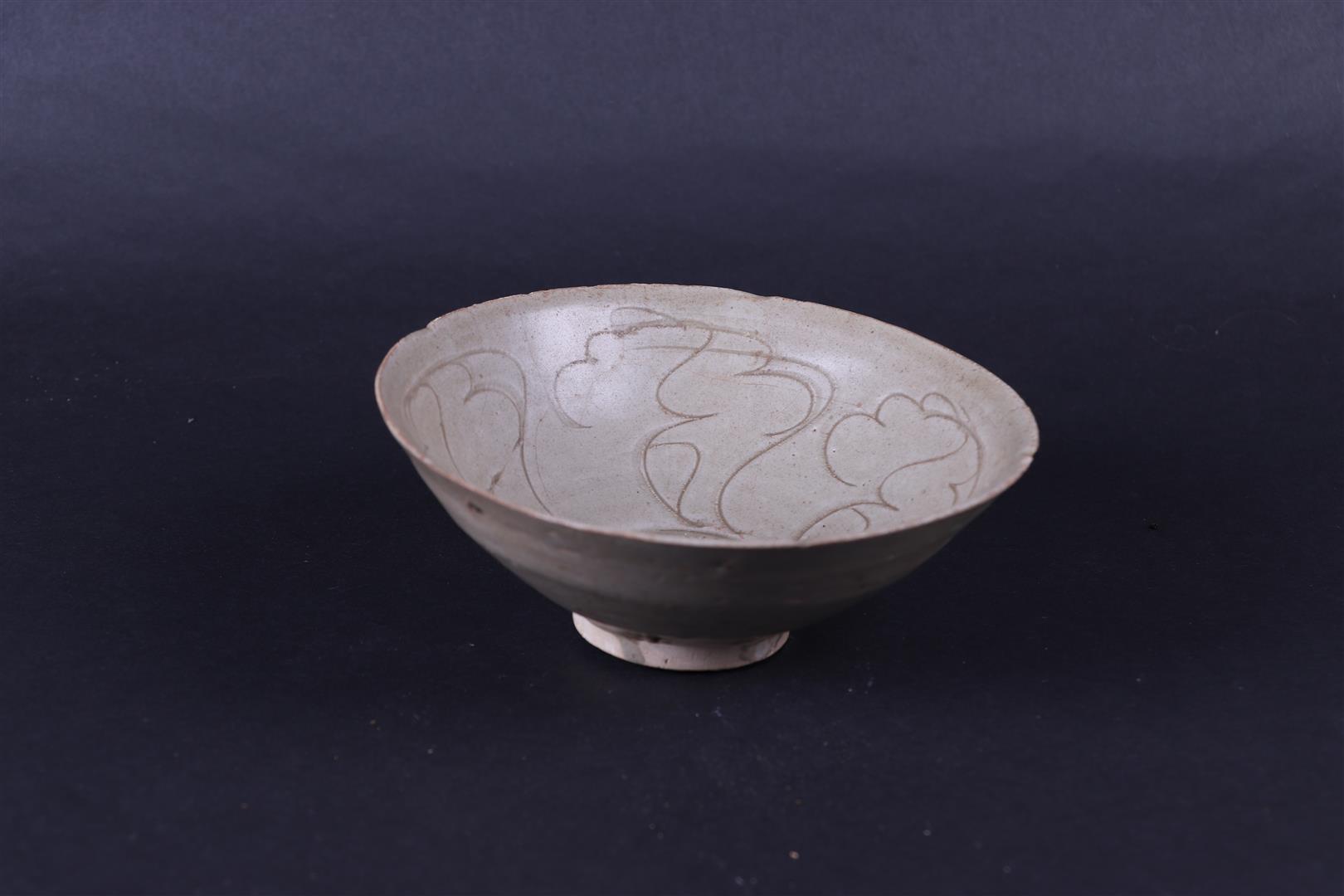 A Celadon bowl, ship find. China, Song.
