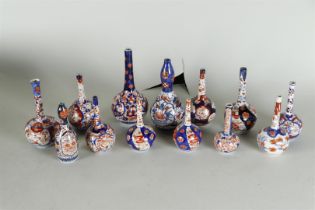 A lot of thirteen Imari pipe vases. Japan, 19th century.