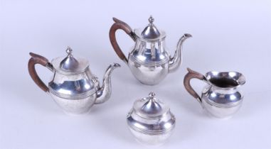 A silver four-piece tea set; Teapot, coffee pot, milk jug and sugar bowl, the teapot with brown wood