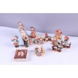 MI. Hummel, a lot of (12) figurines, all marked Goebel.