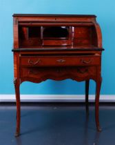 A Charles X-style rolling desk with brass frames.