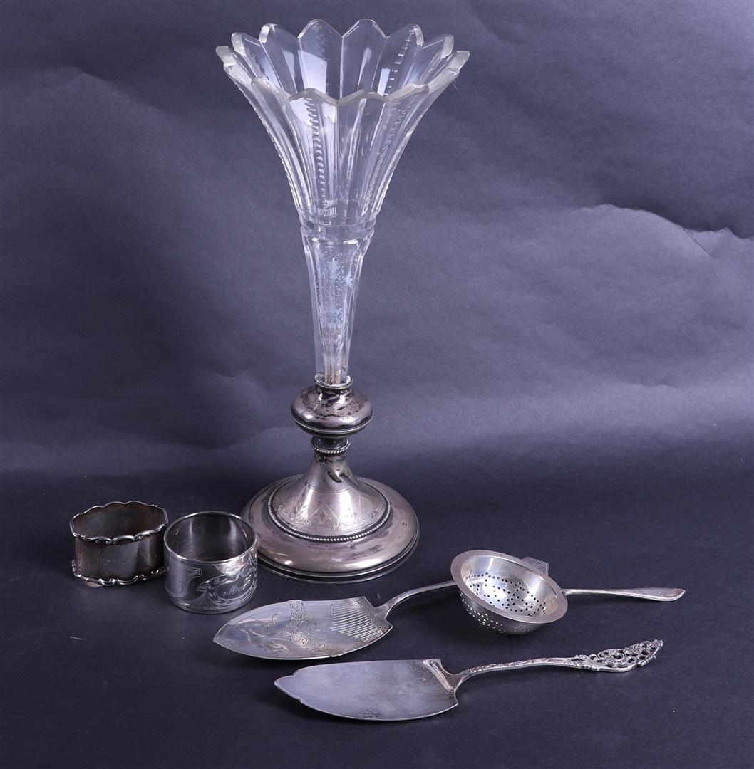 A lot of silver including a vase, serbet rings and a cake server.