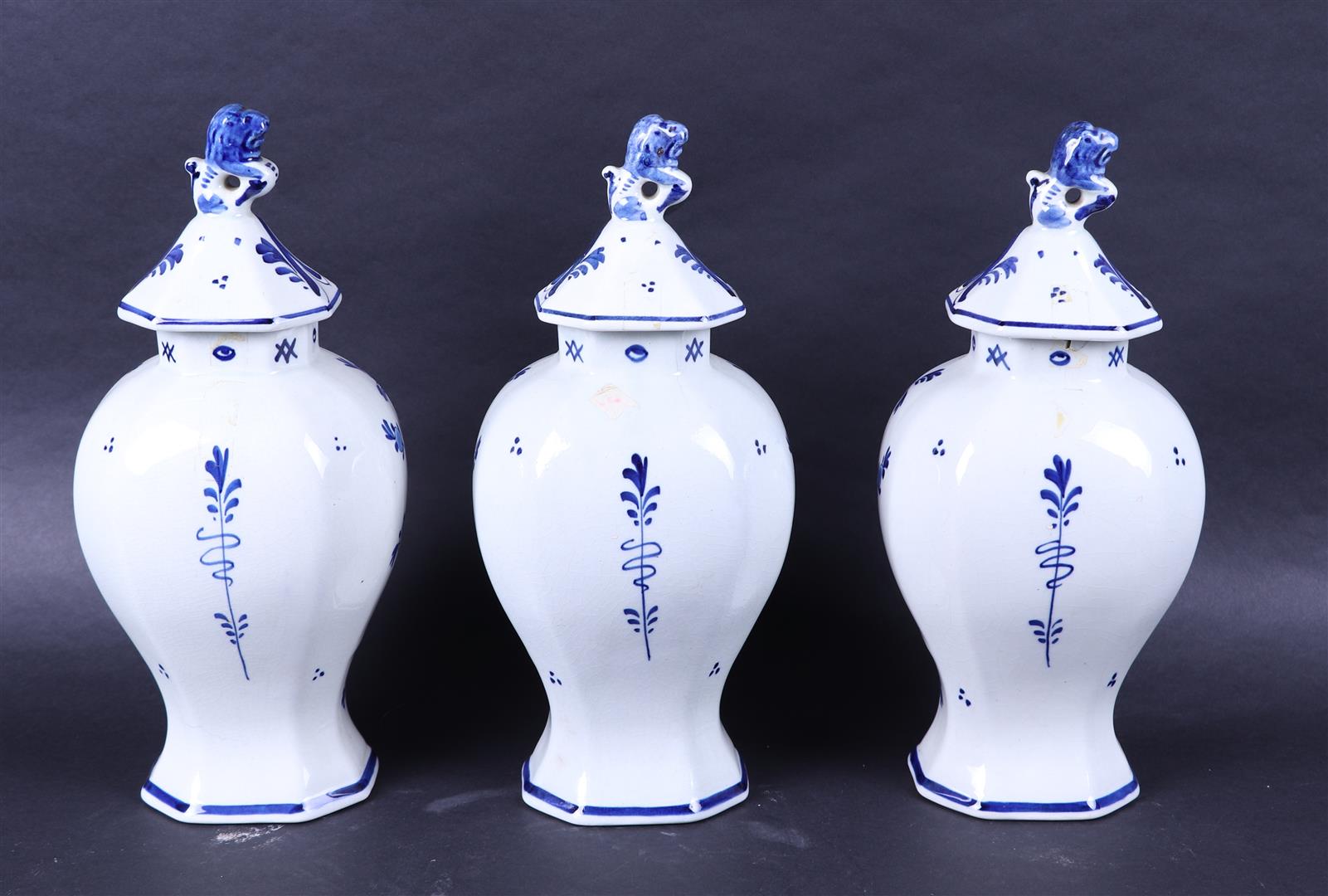 A set of three earthenware cupboard vases with flower basket decor. Porceleyne bottle.
 - Image 3 of 5