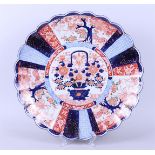 A large lobed Imari wall dish with flower basket decor. Japan, 19th century.
