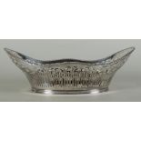 A large silver openwork bread basket, contoured model with pearl edge. 