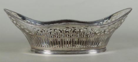 A large silver openwork bread basket, contoured model with pearl edge. 