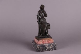 A bronze statue depicting Jeanne D'Arc, mounted on a two-tone marble base. Circa 1900.