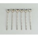 A set of six silver cocktail spoons. Marked with sword