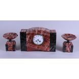 A red marble clock set. France, 19th century.
