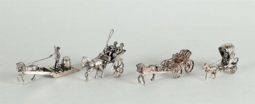 A lot of miniature silver consisting of (2) various carriages, a sledge and a farm wagon.