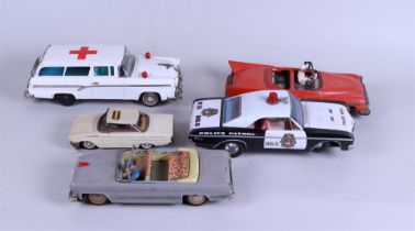 A lot of five vintage tin toy cars including Schuco.