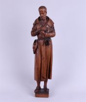 An oak sculpture of a pilgrim.