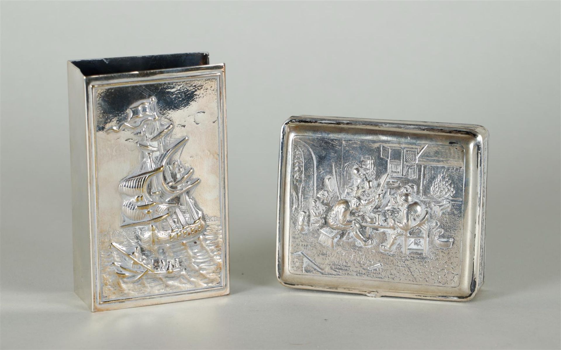 A lot consisting of a silver cigarette case and a silver match holder. Early 20th century