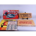 A lot of various vintage iron and cardboard partly advertising signs including Coca Cola.