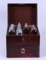 A traveling pharmacy in a mahogany box and copper fittings.