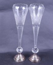 A pair (2) cut crystal flower vases on silver plated base.