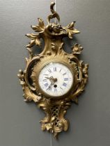 A Louis XV style cartel clock with enamel dial, ca. 1890.