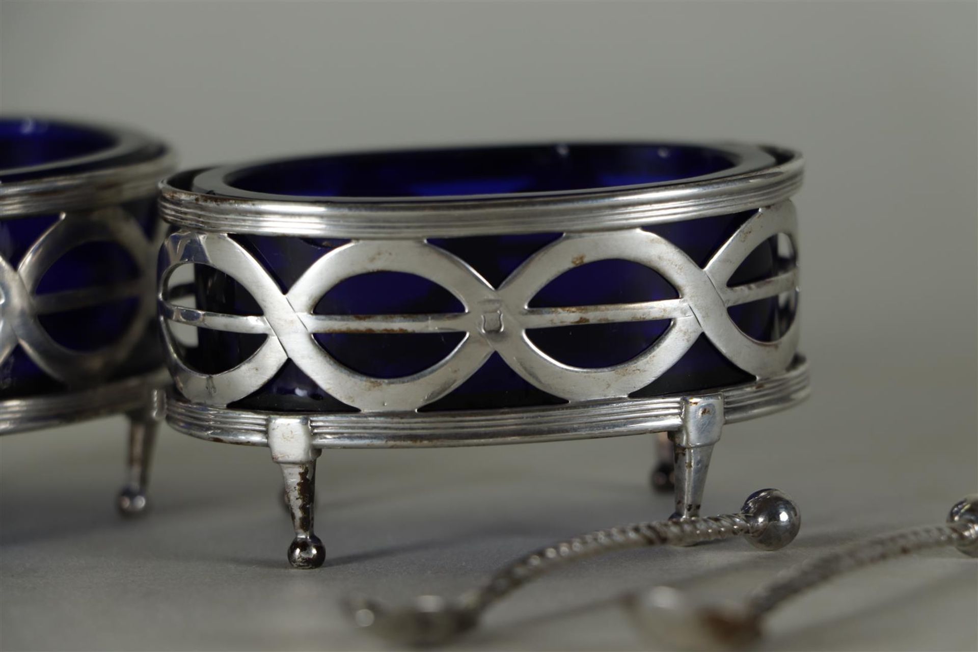 A set of (2) silver Louis XVI salt cellars with blue glass and matching spoons.  - Image 4 of 4