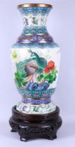 A very large cloisonne vase decorated with various birds and flowers, on wooden base. China, 20th ce