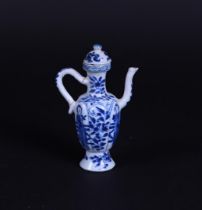 A blue and white jug with frames and floral decor in borders. China, Kangxi.
