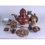 A lot of various Asian objects including a teapot and porcelain.
