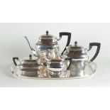 A five-piece coffee and tea set, consisting of a tray, a coffee pot and teapot, a sugar bowl