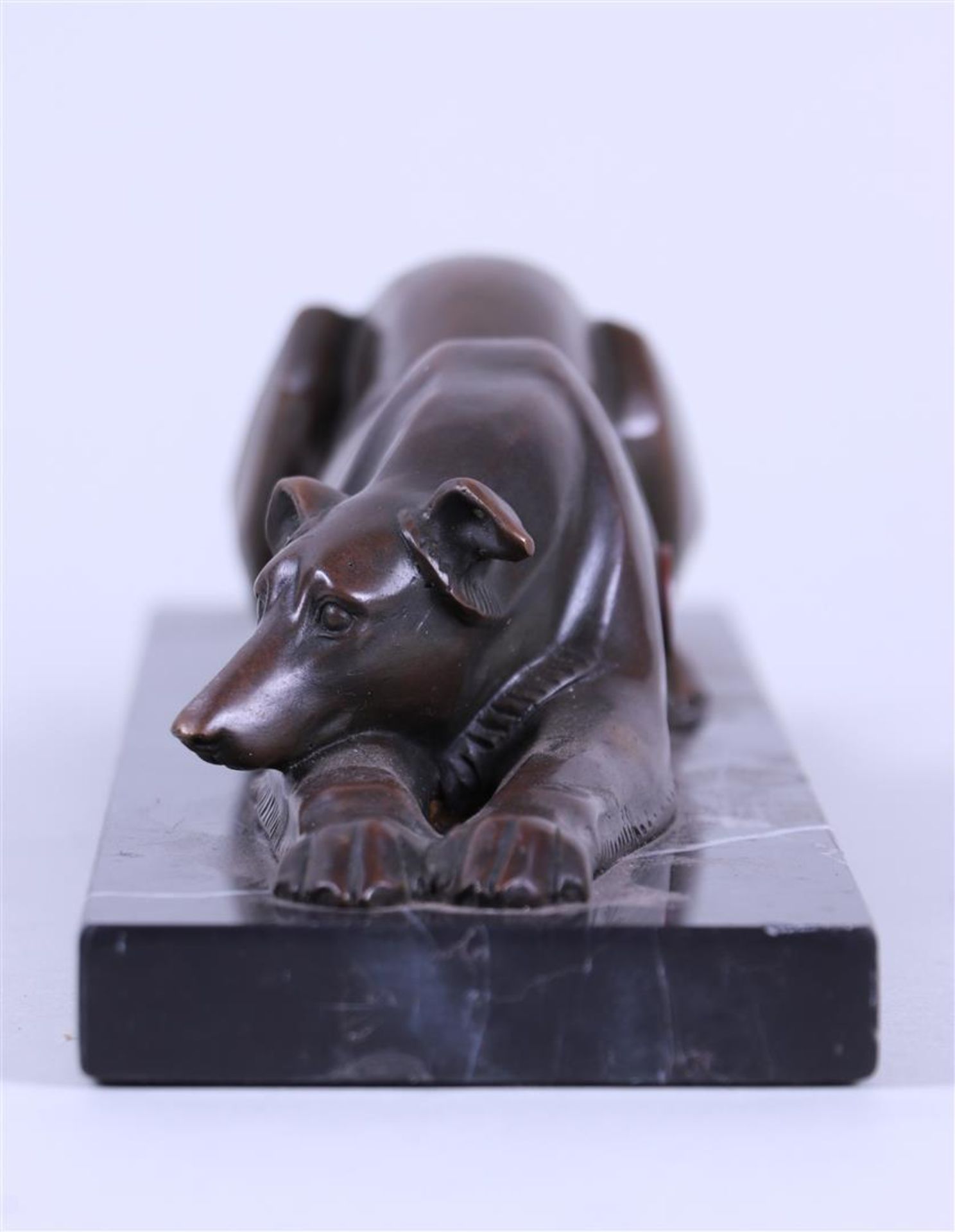 An Art Deco-style sculpture of a greyhound dog on a marble base.
 - Image 2 of 3