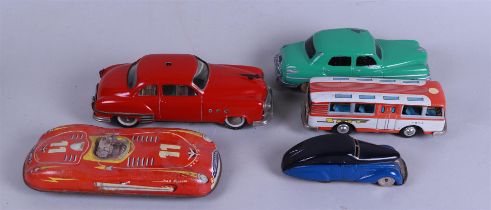 A lot of five vintage tin toy cars.