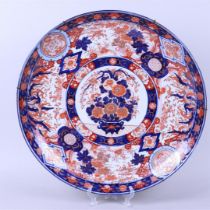 A large Imari wall dish with flower basket decor. Japan, 19th century.