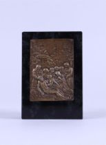 A bronze relief depicting the entombment of Christ mounted on a honed marble base