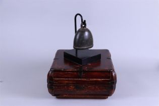 A Chinese 'cow' bell in a box +/- 1900.