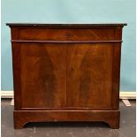 A mahogany glued penant cupboard with black marble top. 19th century.
