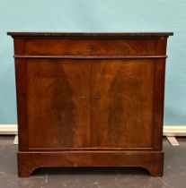 A mahogany glued penant cupboard with black marble top. 19th century.
