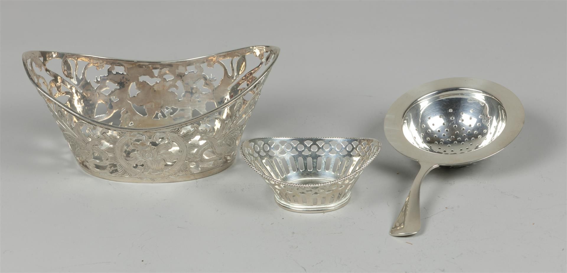 Silver openwork bonbon tray 3rd amount, a dragee tray with pearl rim and a tea strainer 