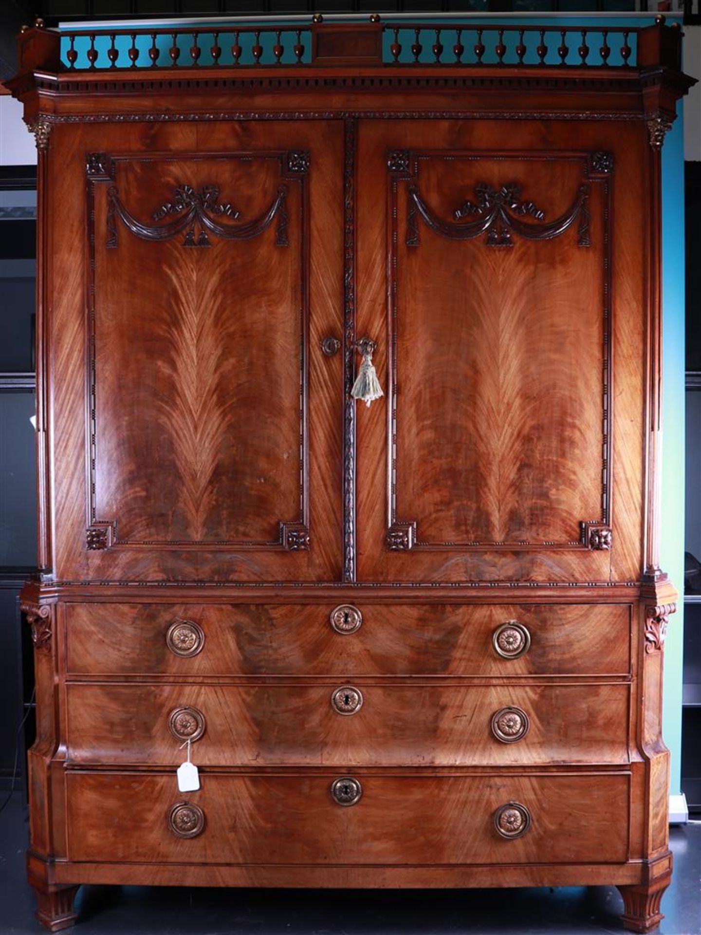 A mahogany trellis cabinet decorated with rosettes, 