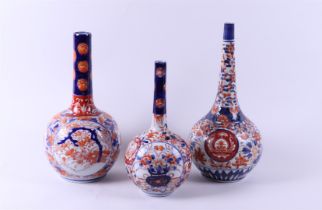 A lot of three Imari pipe vases. Japan, 19th century.