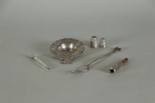 A lot of various silver consisting of a tea strainer, two thimbles, a pickle fork, a pencil